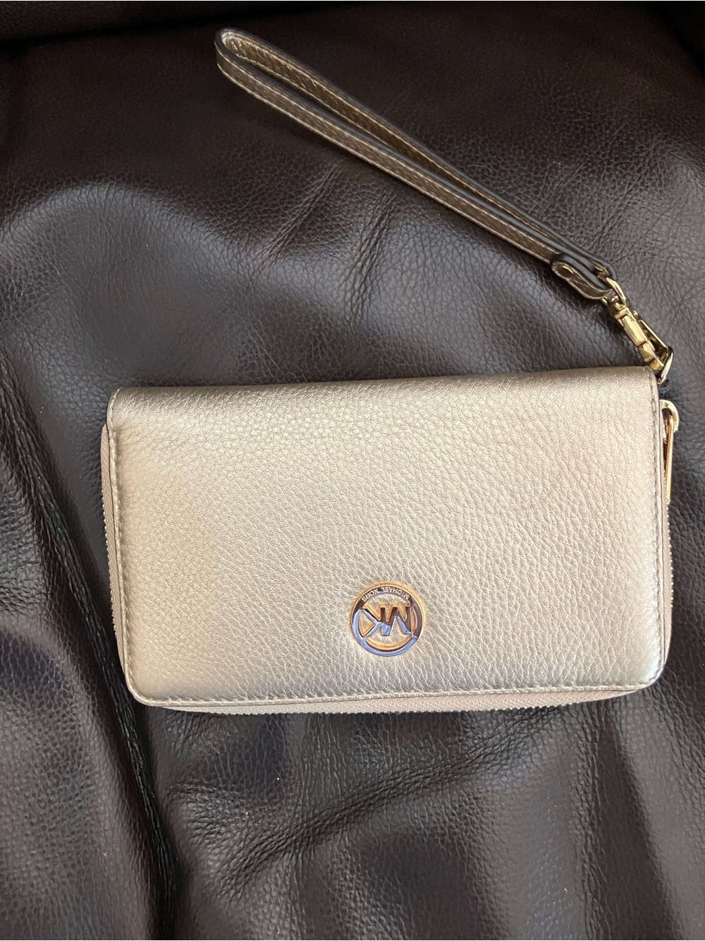 Michael Kors gold wristlet zippered wallet .